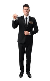 Photo of Happy receptionist in uniform holding key on white background