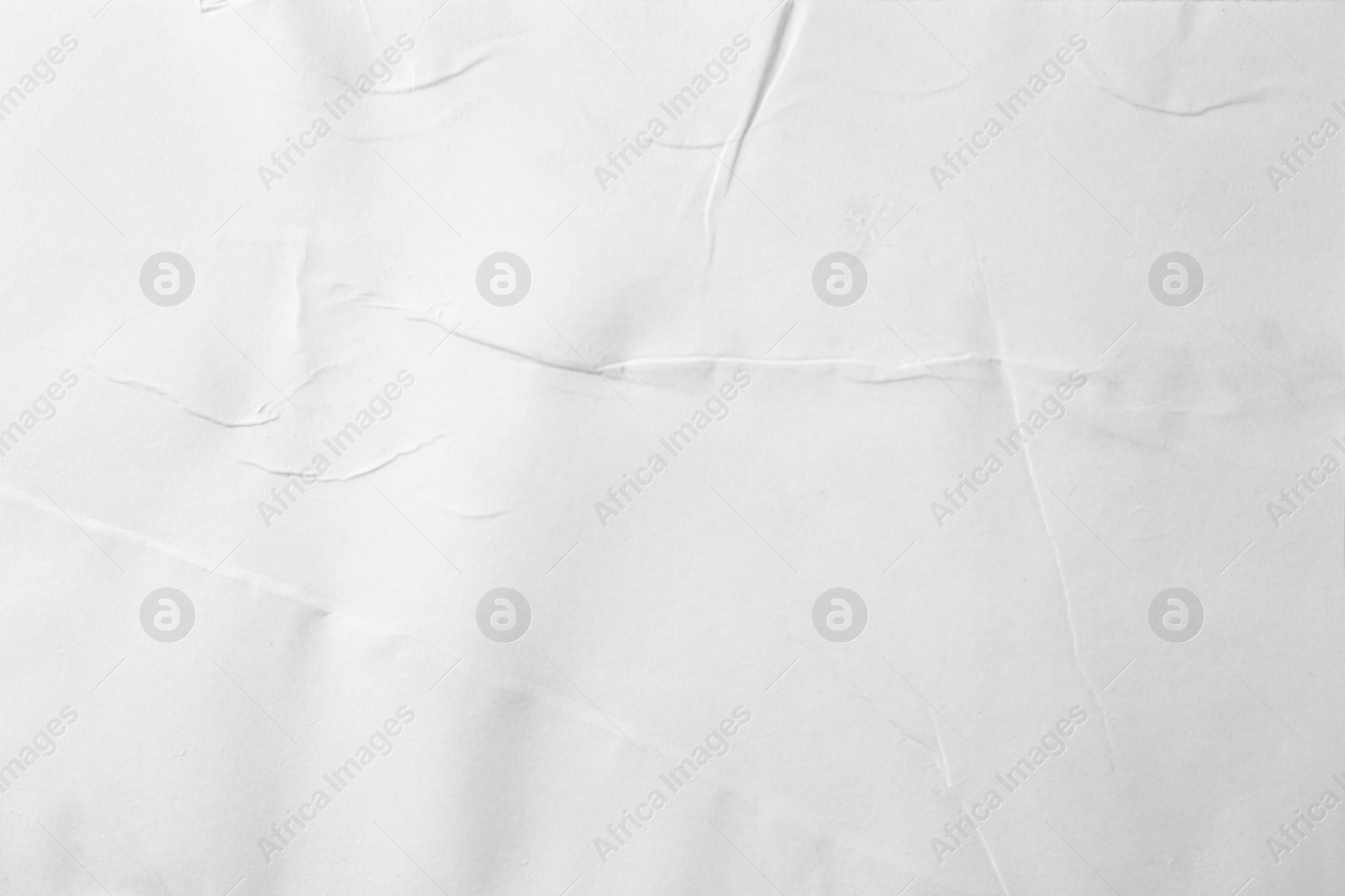 Photo of Texture of white creased paper, closeup view