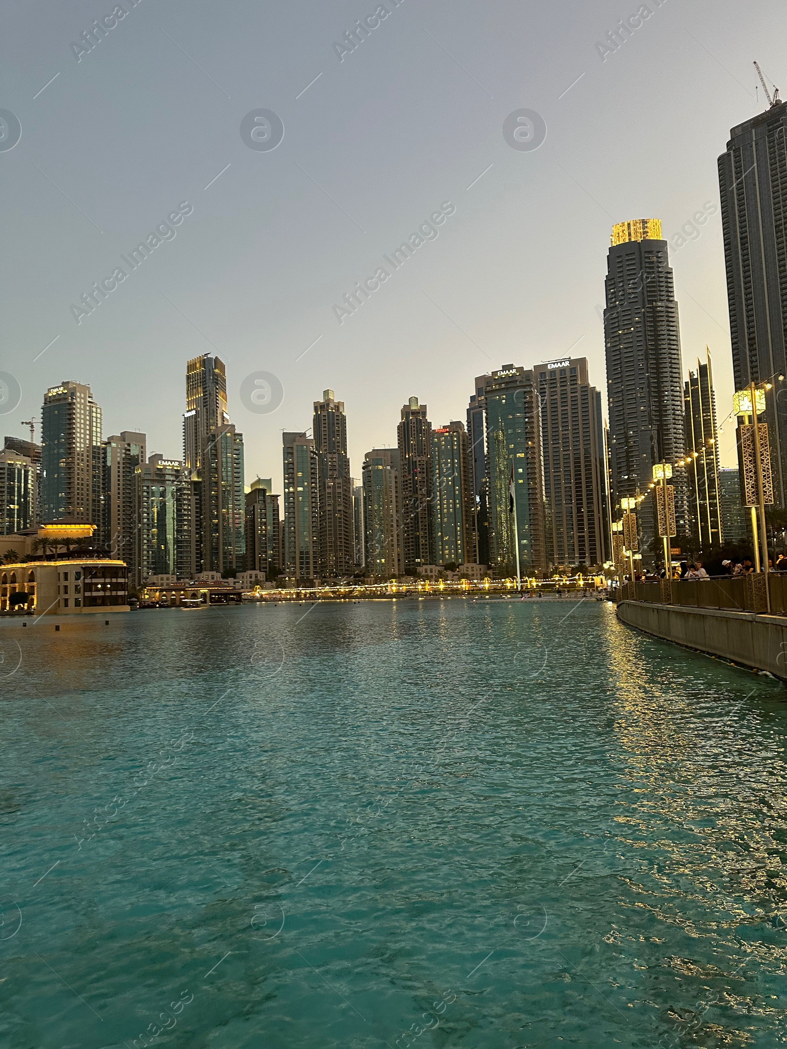 Photo of Dubai, United Arab Emirates - May 2, 2023: Beautiful modern buildings near embankment in city