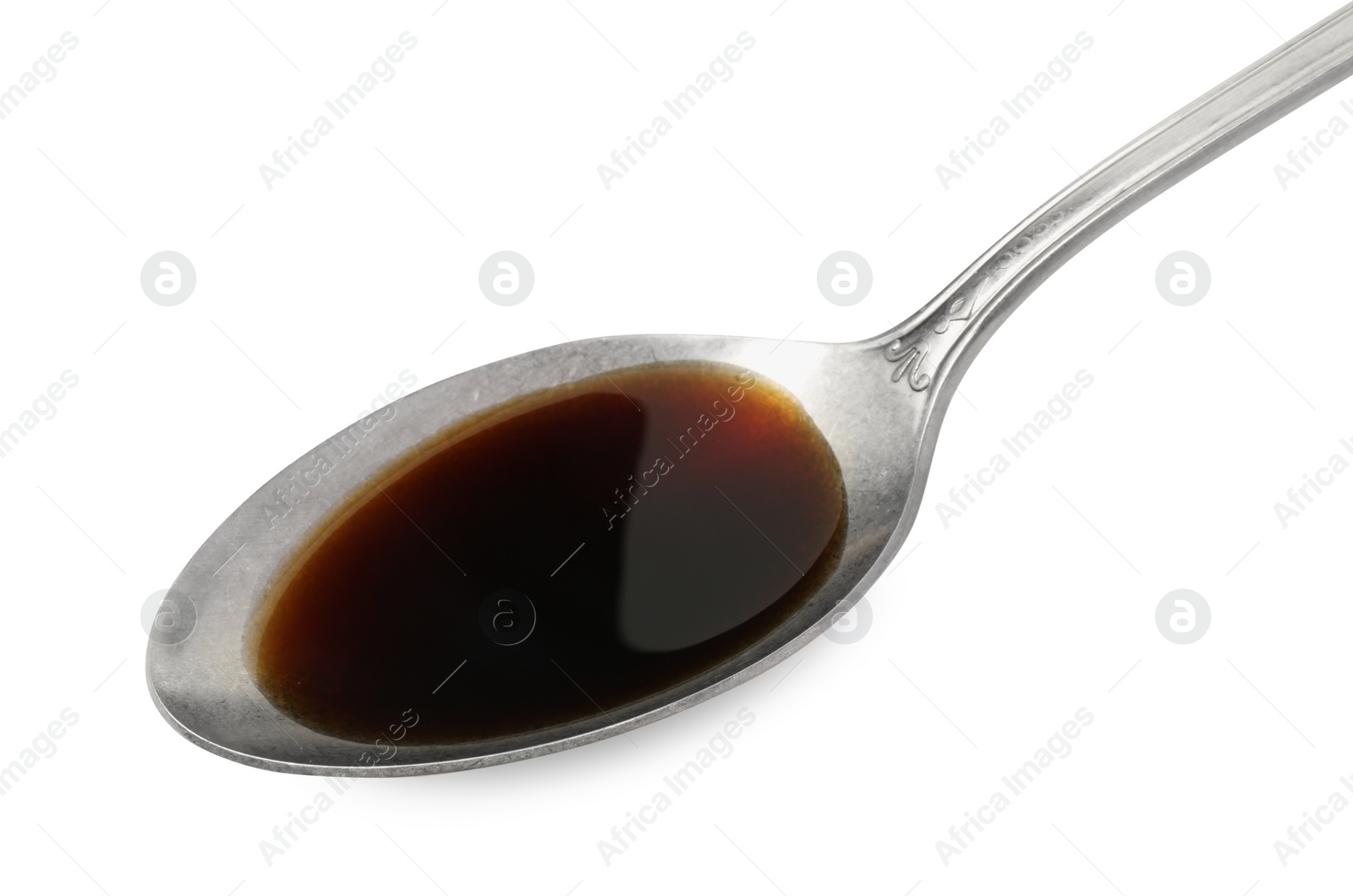 Photo of Tasty soy sauce in spoon isolated on white