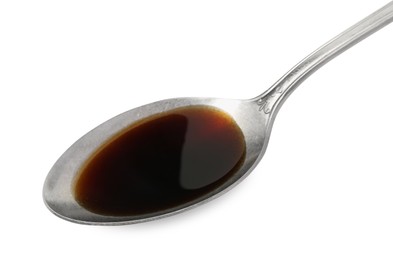 Photo of Tasty soy sauce in spoon isolated on white