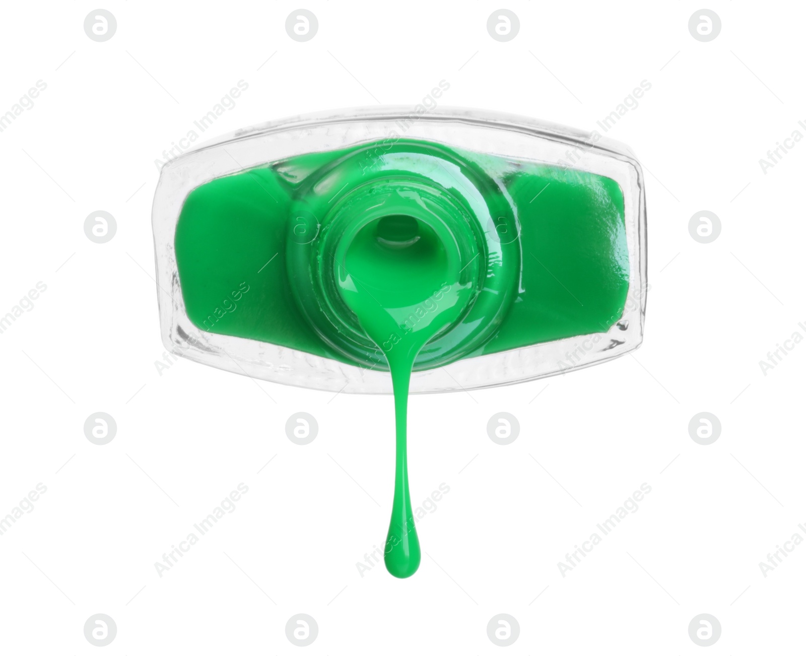 Photo of Green nail polish dripping from bottle isolated on white