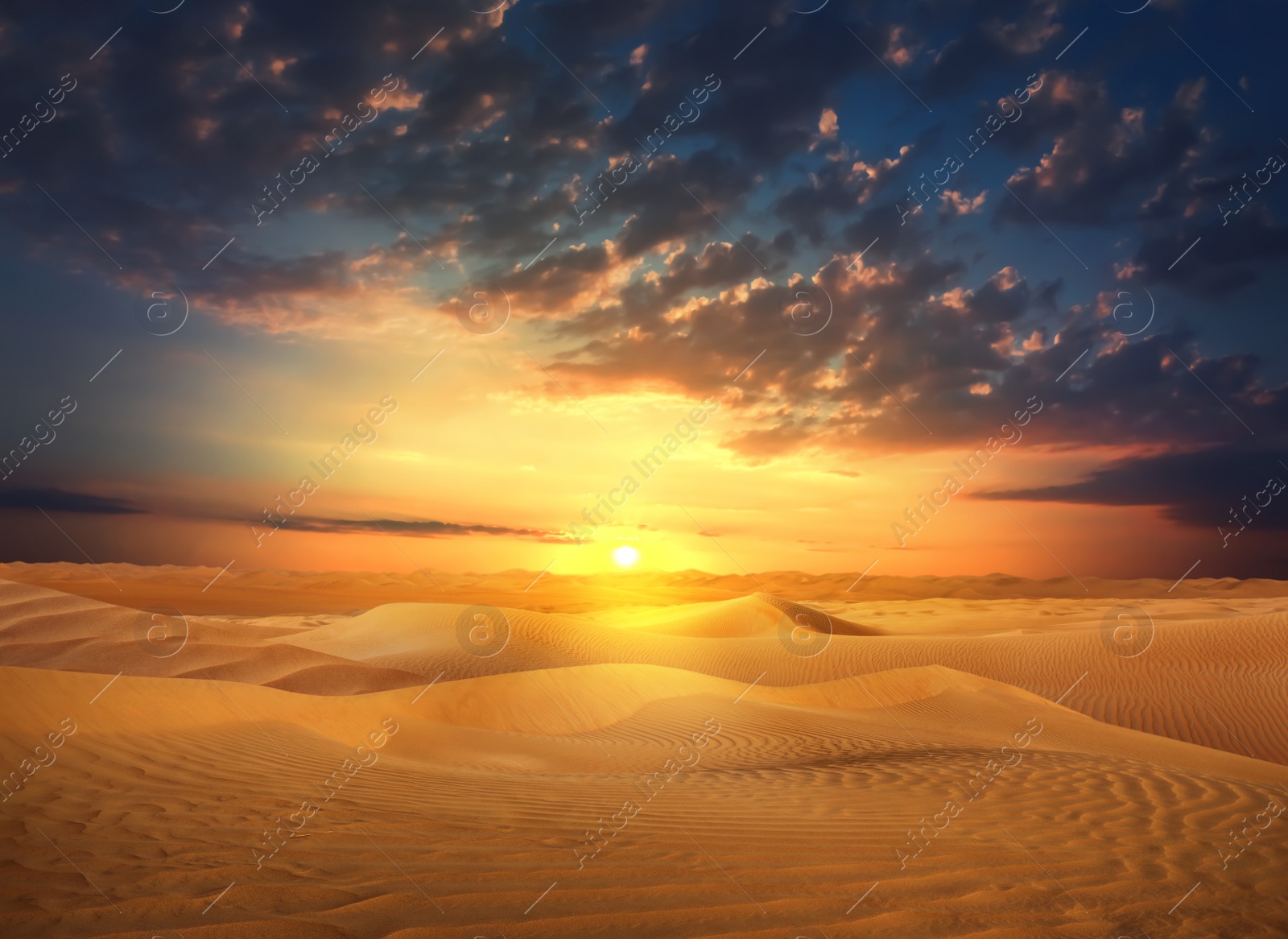 Image of Beautiful view of sandy desert at sunset