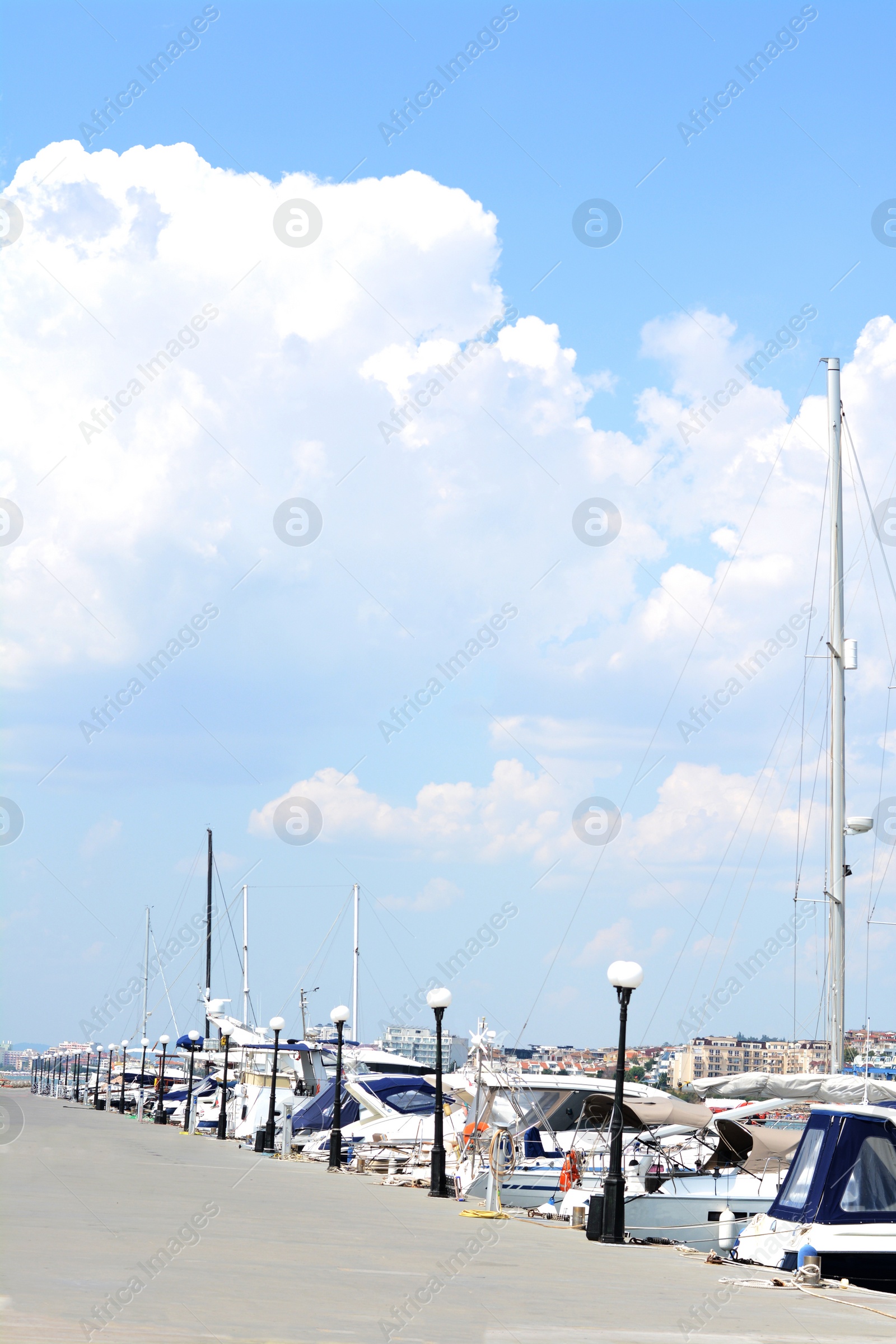 Photo of Beautiful view of city pier with moored boats on sunny day