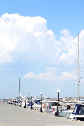 Photo of Beautiful view of city pier with moored boats on sunny day