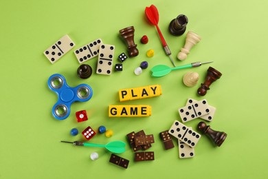 Photo of Flat lay composition of blocks with words Play Game on green background