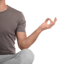 Man meditating on white background, closeup. Harmony and zen