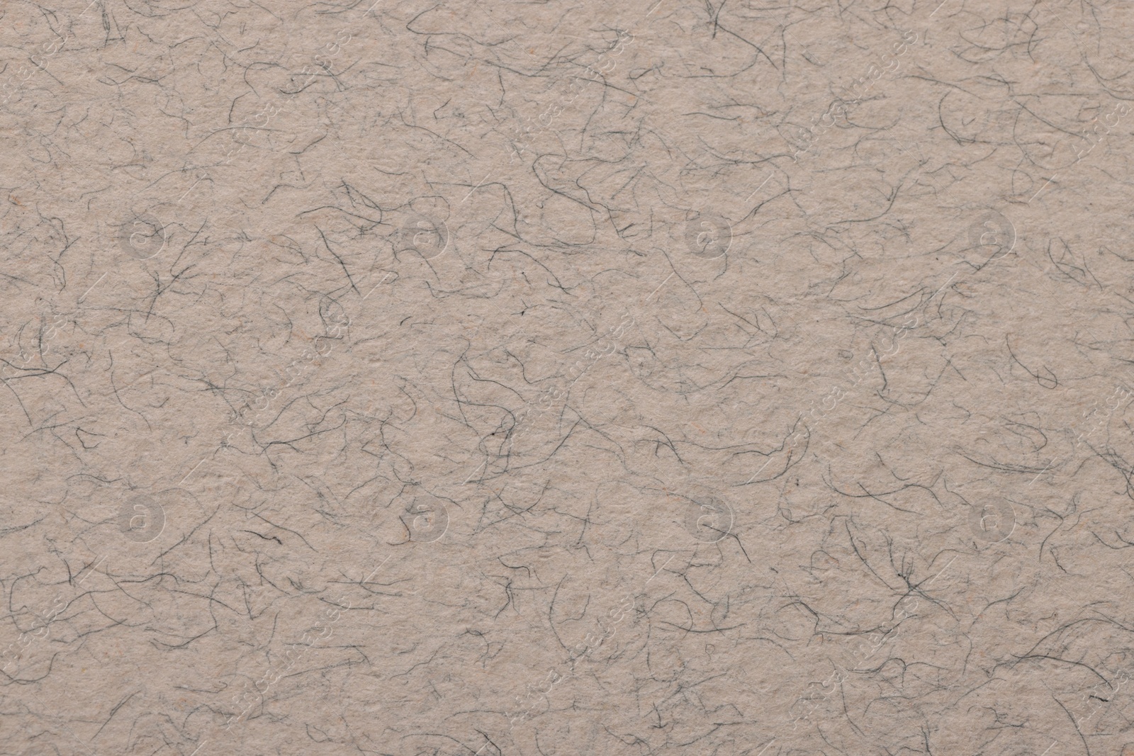 Photo of Texture of light grey paper sheet as background, top view