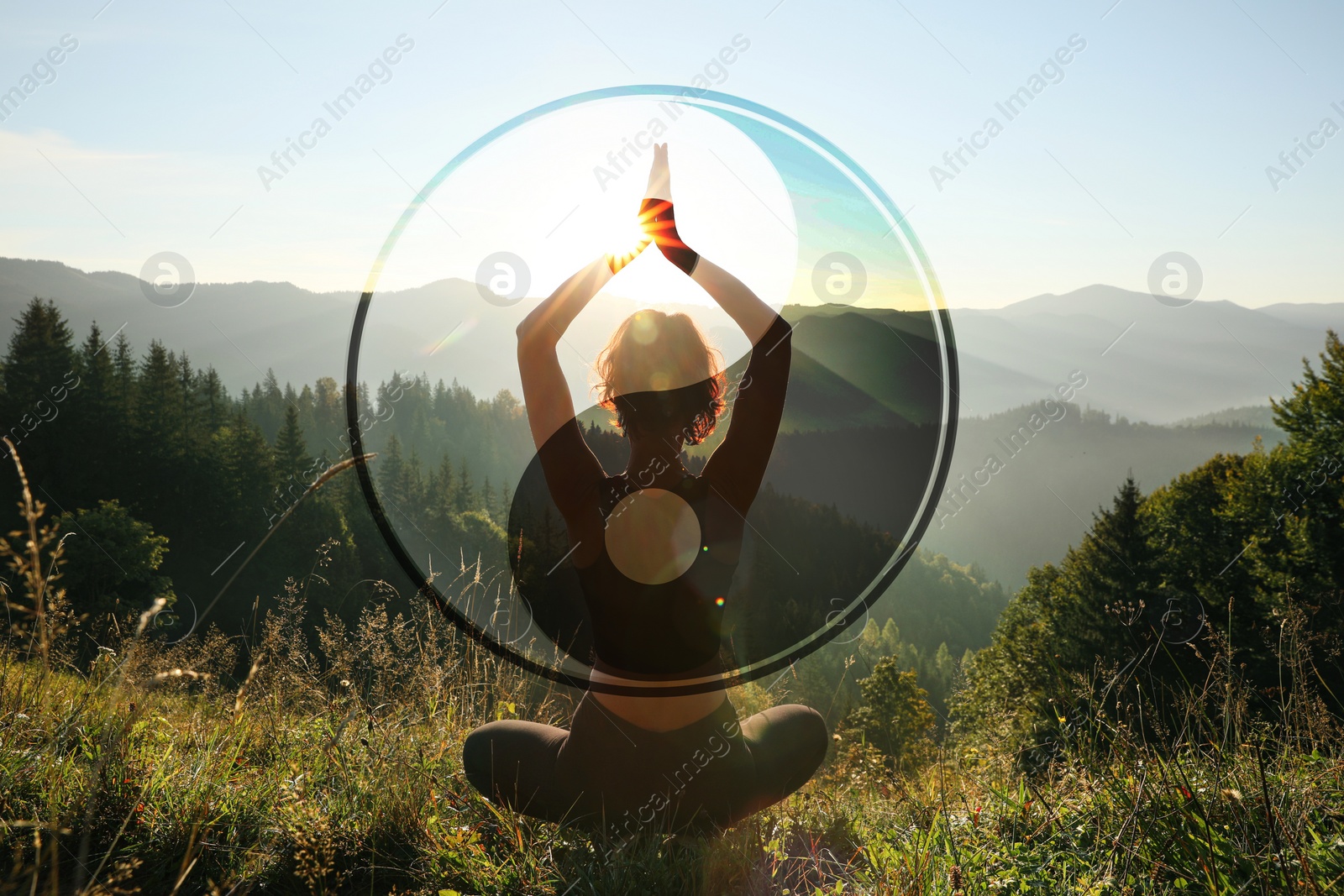 Image of Woman meditating in mountains at sunrise, back view. Yin and yang symbol