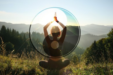 Image of Woman meditating in mountains at sunrise, back view. Yin and yang symbol