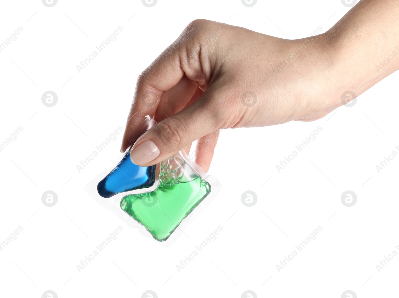 Photo of Woman holding laundry capsule on white background, closeup