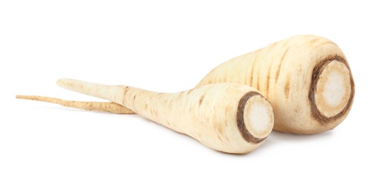 Photo of Tasty fresh ripe parsnips on white background