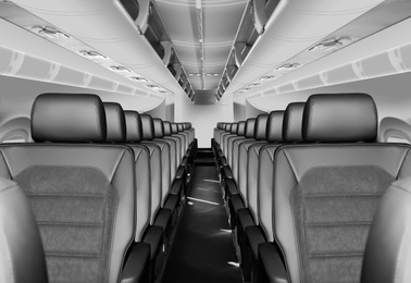 Image of Modern airplane cabin with comfortable seats 