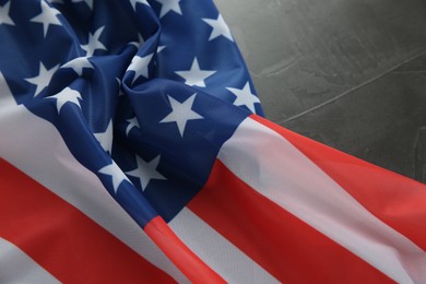 Photo of Flag of USA on black table, closeup. Space for text