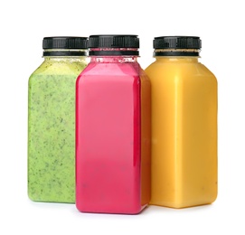 Photo of Bottles with delicious detox smoothies on white background