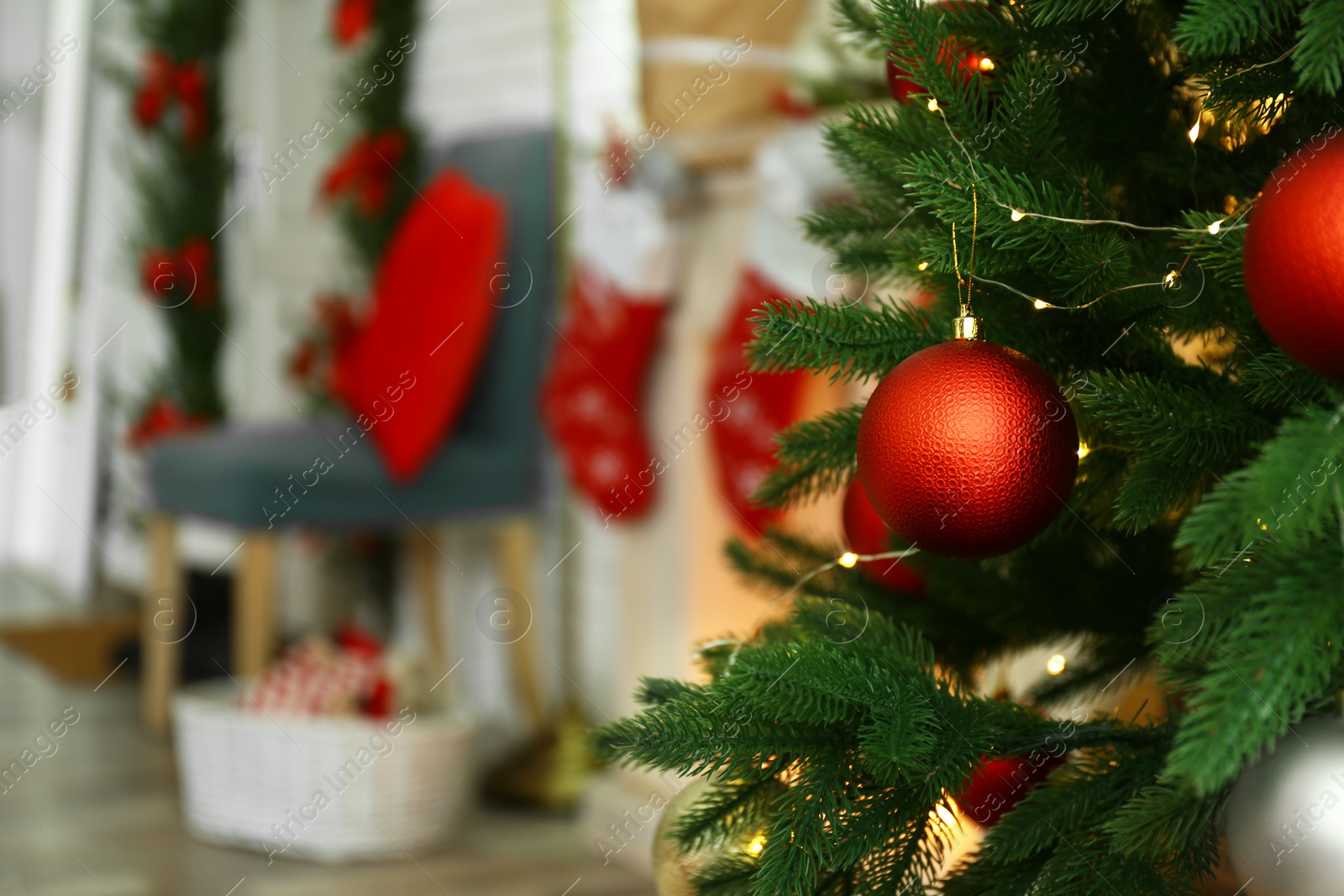 Photo of Blurred view of beautiful festive interior, focus on decorated Christmas tree