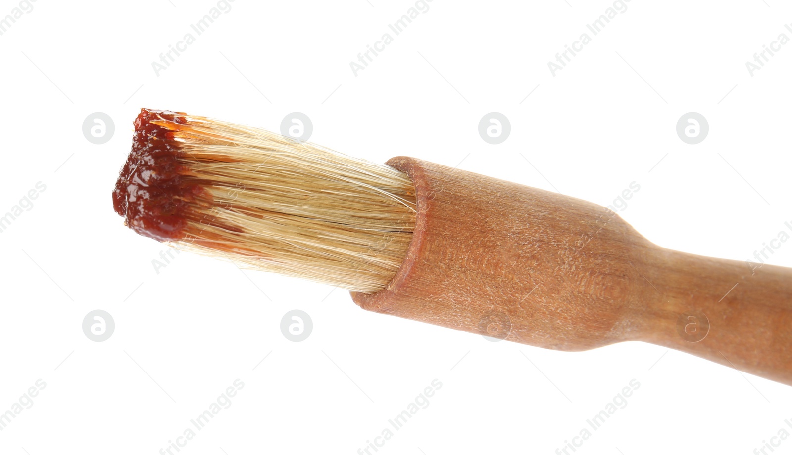 Photo of Basting brush with barbecue sauce on white background