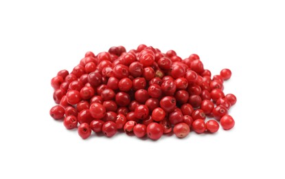 Photo of Aromatic spice. Many red peppercorns isolated on white