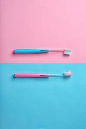 Manual toothbrushes on color background. Dental care