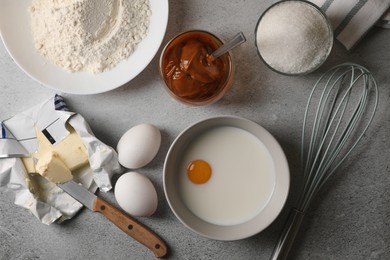 Photo of Ingredients for homemade walnut shaped cookies on grey table, flat lay