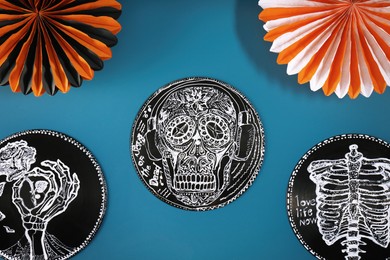 Halloween decorations on blue background, flat lay