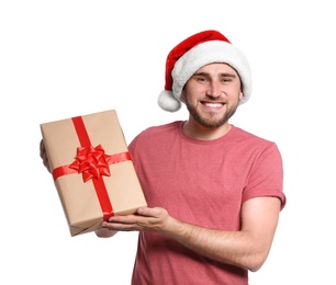 Photo of Young man with Christmas gift on white background