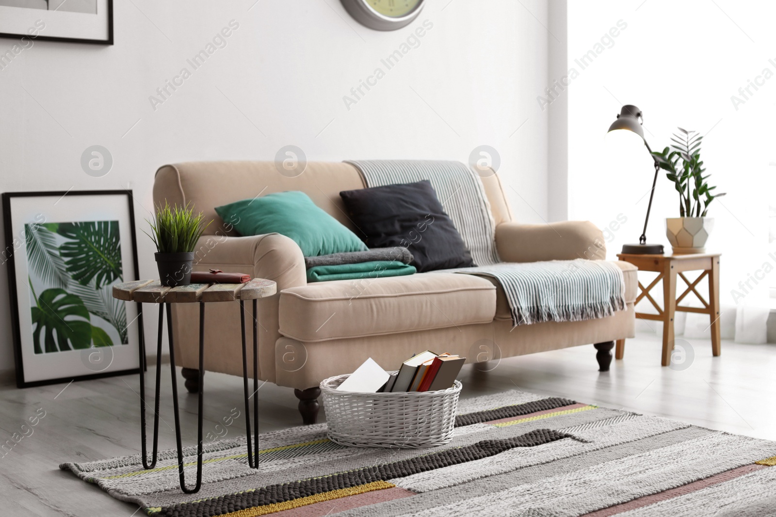 Photo of Stylish living room interior with comfortable sofa and table