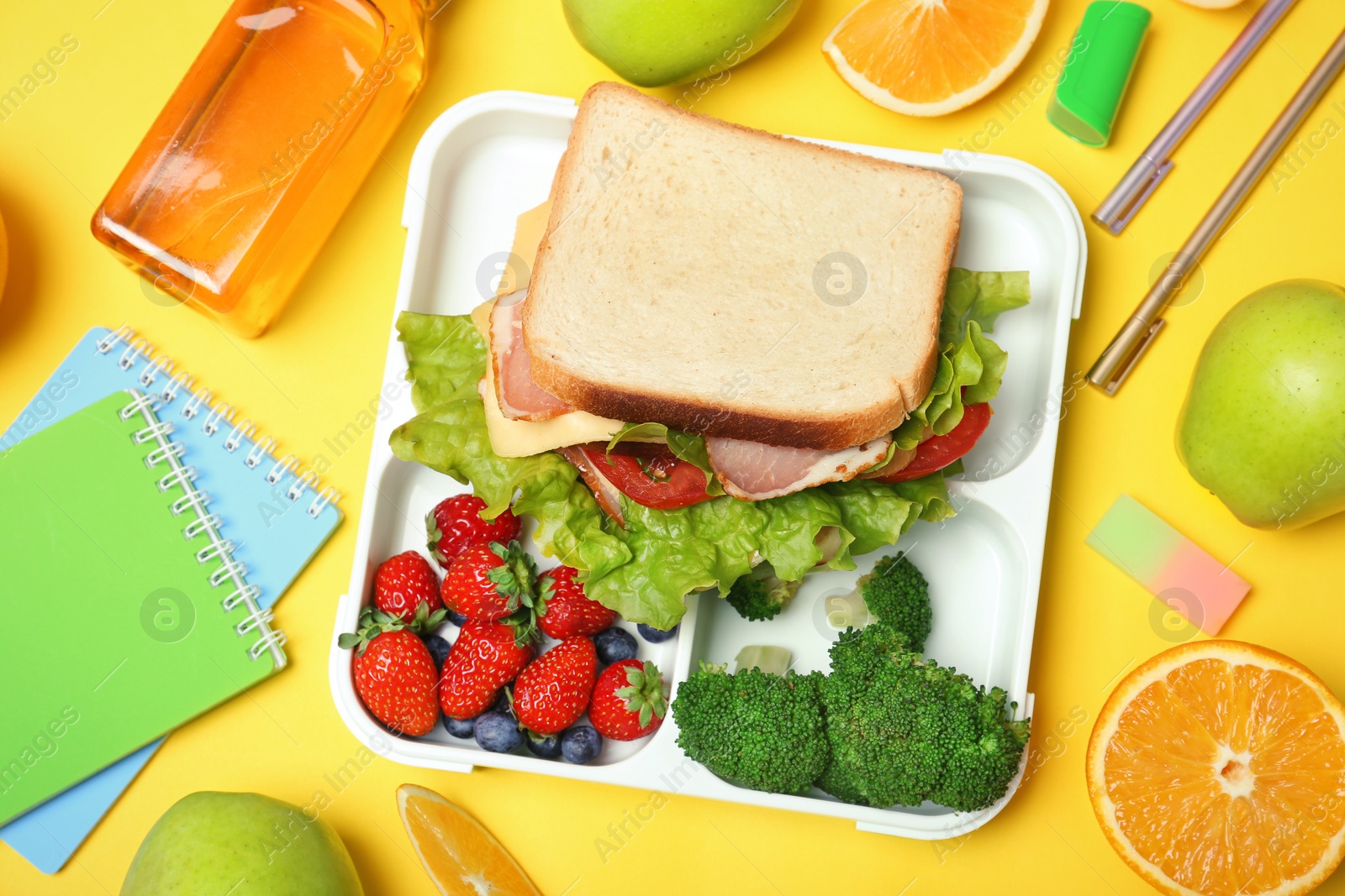 Photo of Flat lay composition with healthy food for school child on color background