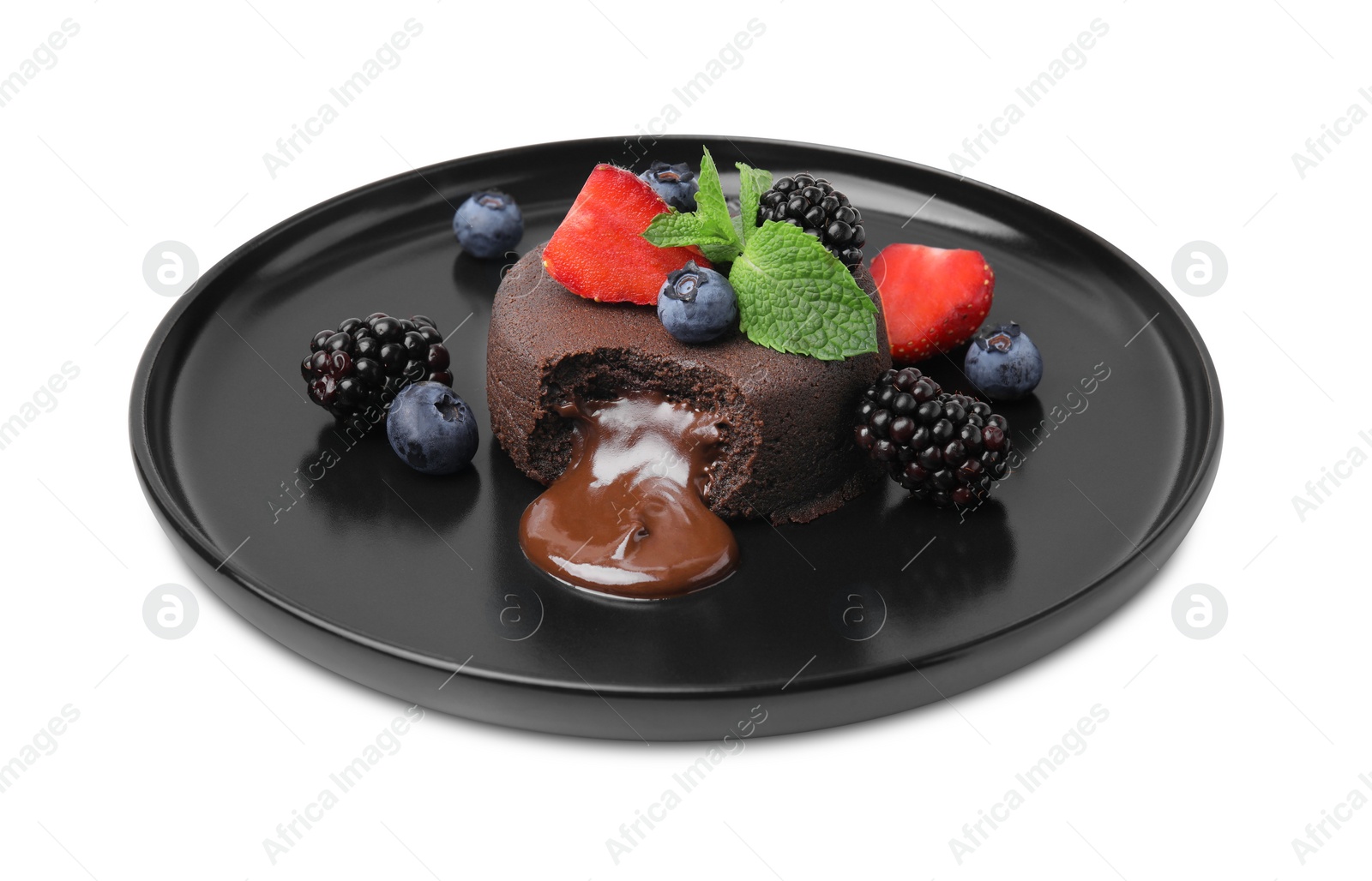 Photo of Plate with delicious chocolate fondant, berries and mint isolated on white