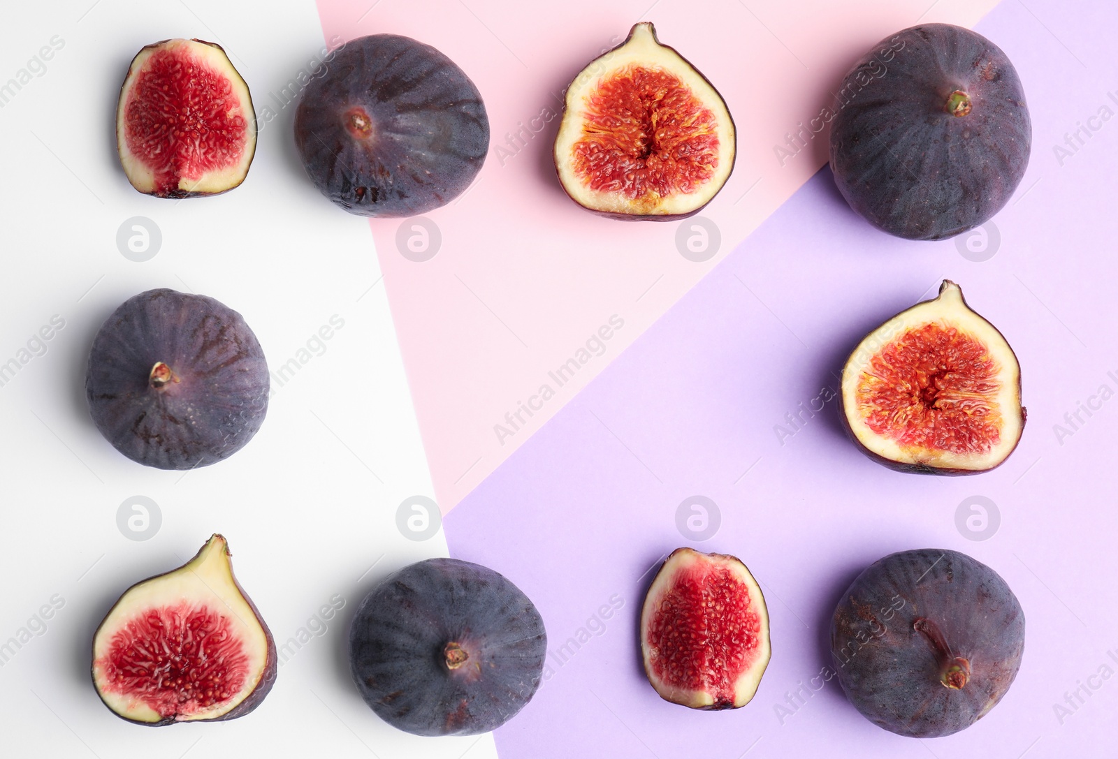 Photo of Delicious ripe figs on color background, flat lay. Space for text