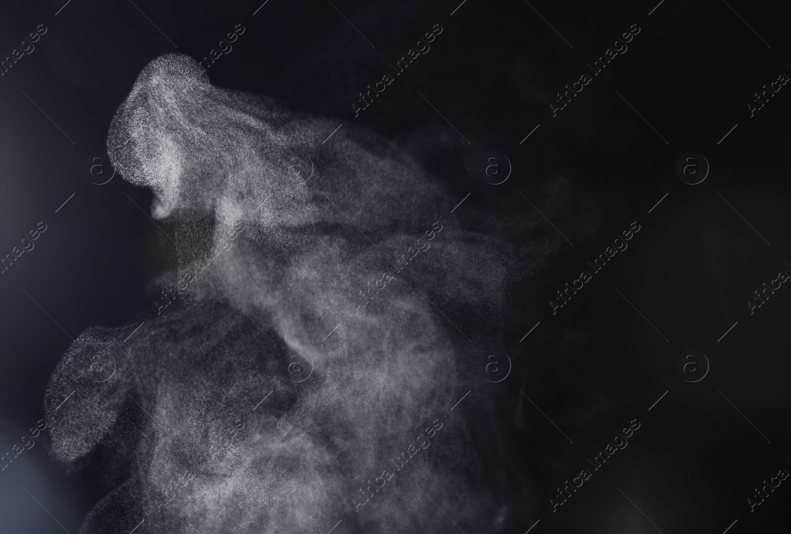 Photo of White steam in air against black background