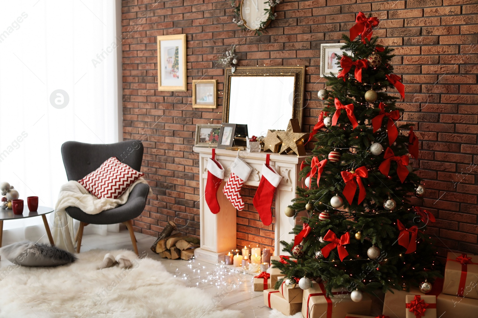 Photo of Room interior with beautiful Christmas tree near decorative fireplace