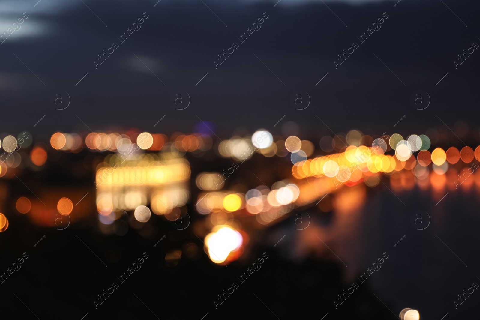 Photo of Blurred view of beautiful city at night. Bokeh effect