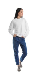 Photo of Full length portrait of young woman in sweater isolated on white. Mock up for design