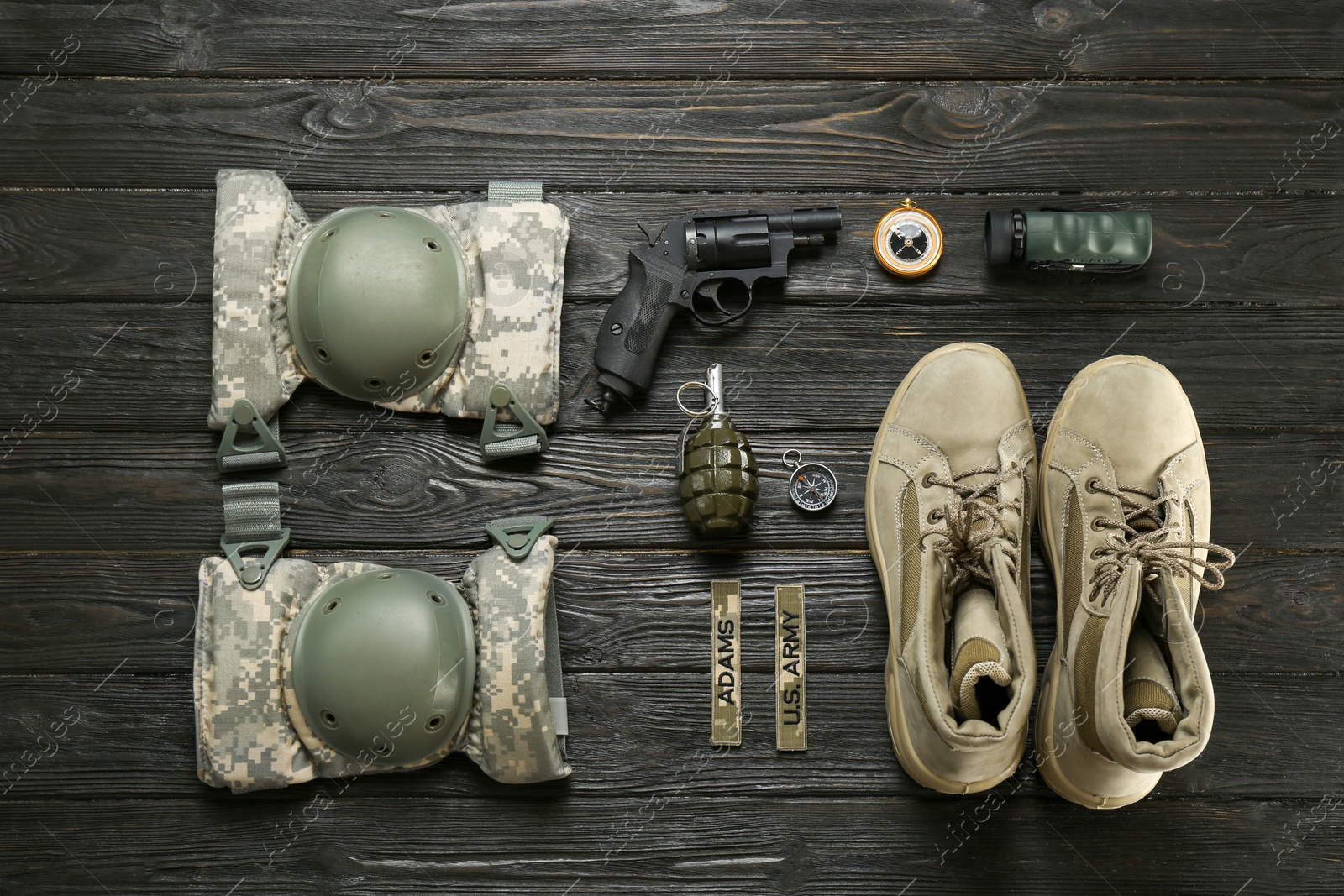 Photo of Set of military equipment and combat boots on wooden background, flat lay
