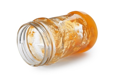 Jar with peach jam on white background