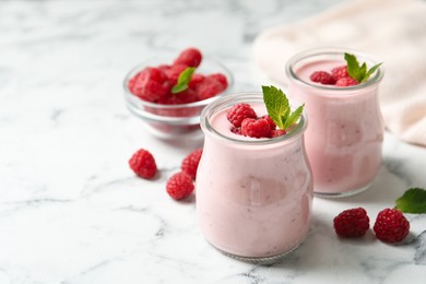 Yummy raspberry smoothie on white marble table