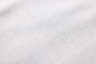 Photo of Texture of white fabric as background, top view