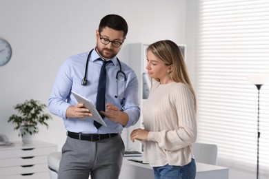 Photo of Professional doctor working with patient in hospital