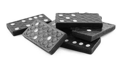 Photo of Classic black domino tiles on white background