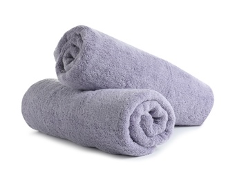 Photo of Fresh soft rolled towels isolated on white