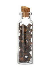 Glass bottle with spice on white background