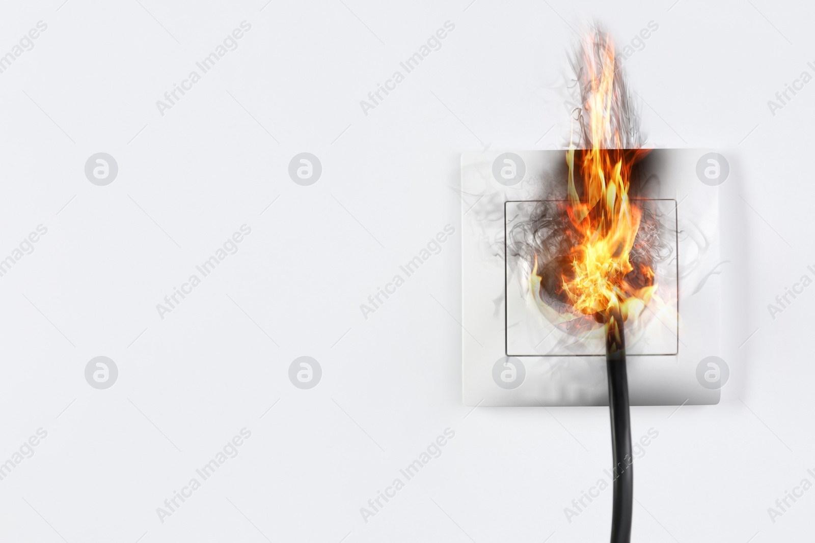 Image of  Electrical short circuit leading to plug ignition. Space for text