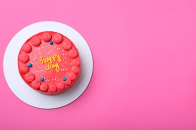 Photo of Cute bento cake with tasty cream on pink background, top view. Space for text