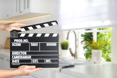 Image of Assistant holding clapperboard on filming location, closeup. Cinema production 