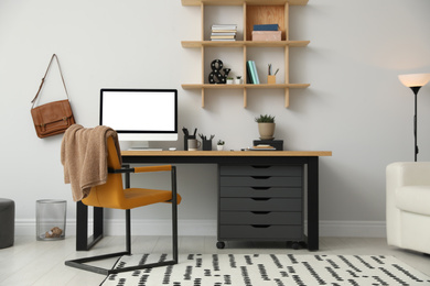 Photo of Stylish room interior with modern comfortable workplace
