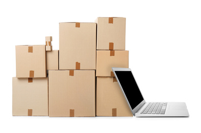 Image of Online selling. Laptop and parcels on white background
