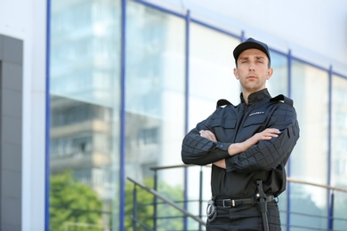 Photo of Portrait of male security guard in uniform outdoors