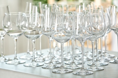 Photo of Set of empty glasses on grey table