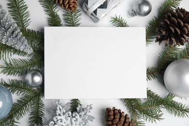 Photo of Beautiful Christmas decor and blank card on white background, flat lay